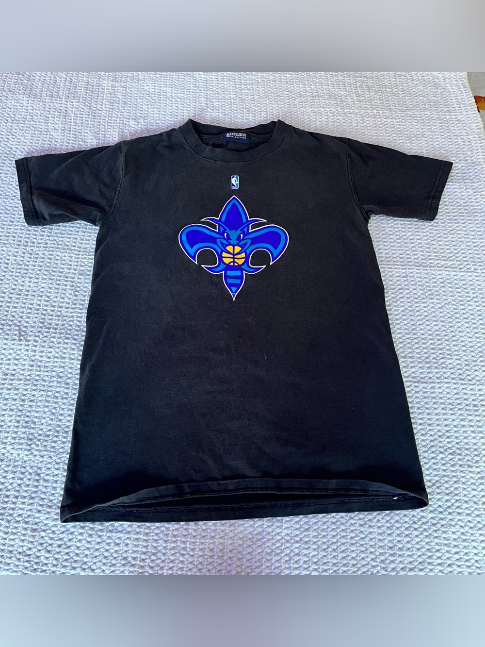 NBA Black Kids Tee with Blue and Yellow Fleur-de-Lis Logo
